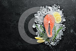 Fresh salmon steak on ice. Top view.