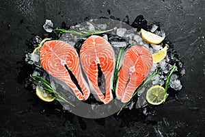 Fresh salmon steak on ice. Top view.