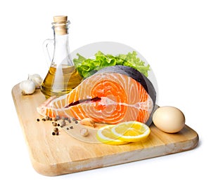 Fresh salmon steak on wooden cooking desk