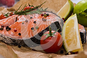 Fresh salmon steaks surrounded with spices