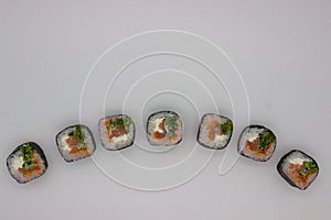 Fresh Salmon Sushi Rolls on a White Background