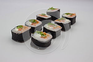 Fresh Salmon Sushi Rolls on a White Background