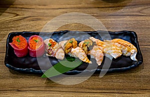 Fresh salmon sushi , salmon maki roll Japanese food restaurant, salmon sushi on plate. Sushi platter with a mixed variety of the