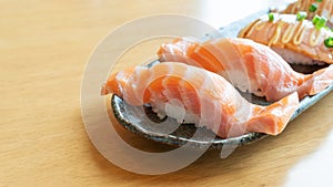 Fresh salmon sushi on a wooden table