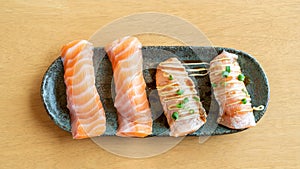 Fresh salmon sushi on a wooden table