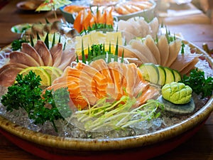 Fresh salmon, tuna and hamachi on ice in dish. Japanese food sashimi set