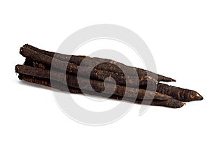 FRESH SALSIFY tragopogon porrifolius AGAINST WHITE BACKGROUND