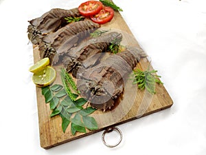 Fresh Sand Lobster or Flathead Lobster or Slipper Lobster (Thenus Orientalis) decorated with herbs and vegetables . photo