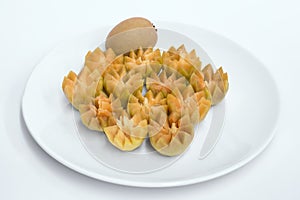 Fresh Sapodilla fruit carving on the plate