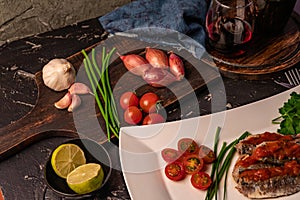 fresh sardines with tomato sauce and other vegetables