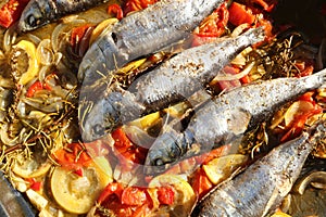 Fresh Sardines with vegetable on a plate