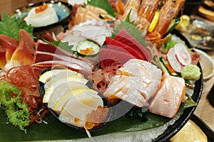 fresh sashimi combo on dish in Japanese restaurant