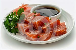 Fresh Sashimi Salmon Pieces with Soy Sauce and Parsley on White Plate Isolated on White Background