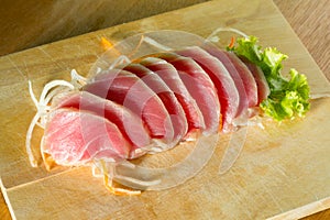 Fresh sashimi on wood background