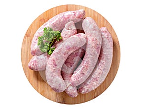Fresh sausages on a chopping board isolated on white background