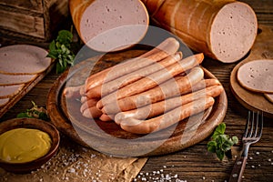 Fresh sausages served with mustard