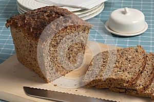 Fresh Scandinavian loaf and slices of sourdough spelt bread close up on a cutting board