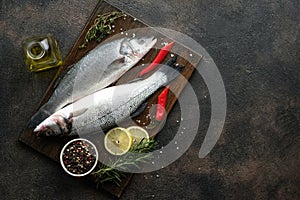 Fresh seabass and ingredients for cooking