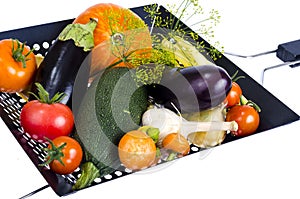 Fresh seasonal vegetables for frying in grill pan on white background