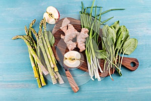 Fresh seasonal vegetables on rustic wooden background