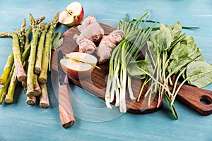 Fresh seasonal vegetables on wooden table top texture