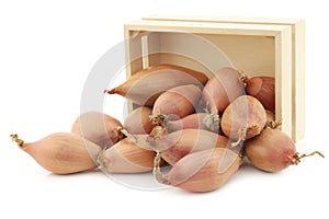 Fresh shallots in a wooden box