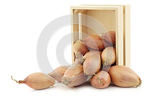 Fresh shallots in a wooden box