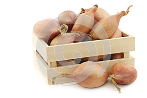 Fresh shallots in a wooden box