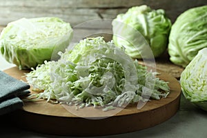 Fresh shredded cabbage on light table, closeup