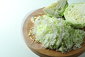 Fresh shredded cabbage on light table, closeup