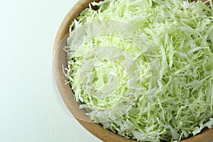 Fresh shredded cabbage on light table, top view