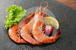 Fresh shrimp prawn seafood plate with shellfish shrimps and lemon herb, Seafood fresh shrimps boil or steam for cook food with on