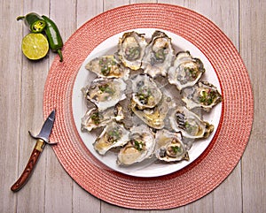 Fresh shucked oysters with jalapeno & lemon mignonette