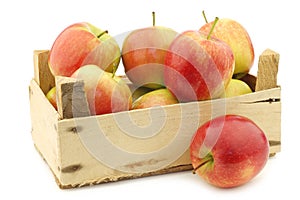 Fresh `Sissi red` apples in a wooden crate