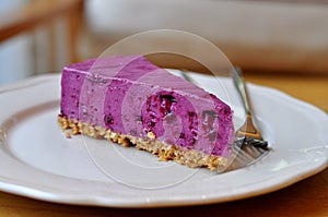 Fresh slice of blueberry cheesecake.