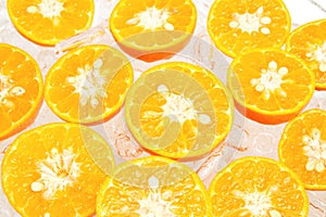 Fresh slice oranges in ice photo