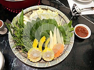 Fresh slice vegetables set cut into pieces and arranged on a plate for cooking to grill and boil.-Set for shabu,hotpot,suki Asian