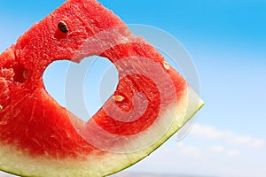 Fresh slice of watermelon with heart inside