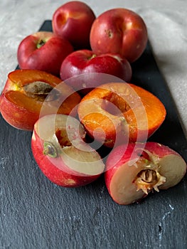 Fresh sliced apricots on a dark background