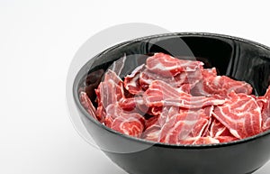 Fresh sliced beef hind shank in black ceramic bowl