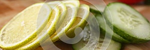 Fresh sliced cucumber and citrus lemon for further cooking