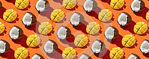 Fresh sliced Mango with coconut in pattern on the orange background. Fresh fruits. Top view  .Healthy and tasty. Continous pattern