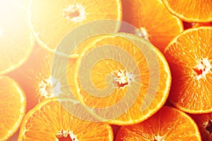 Fresh sliced orange fruit texture. Macro, top view, copy space. Food frame. Juicy oranges background