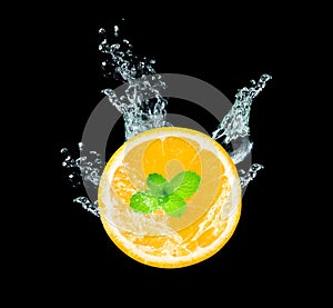 Fresh sliced orange fruit in water splash