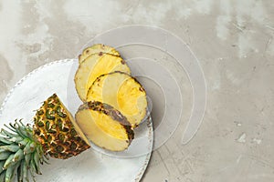 Fresh sliced pineapple on a cutting board