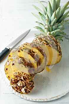 Fresh sliced pineapple on a cutting board
