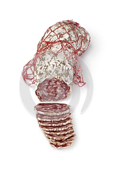 Fresh sliced Rosette de Lyon, a French pork saucisson on white background