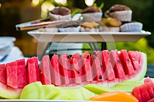 Fresh sliced watermellon at a spring festival picnic photo