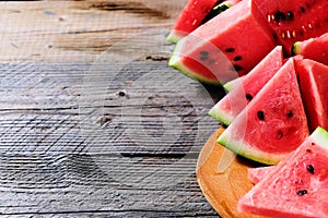 Fresh sliced watermelon wooden background