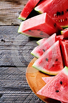 Fresh sliced watermelon wooden background